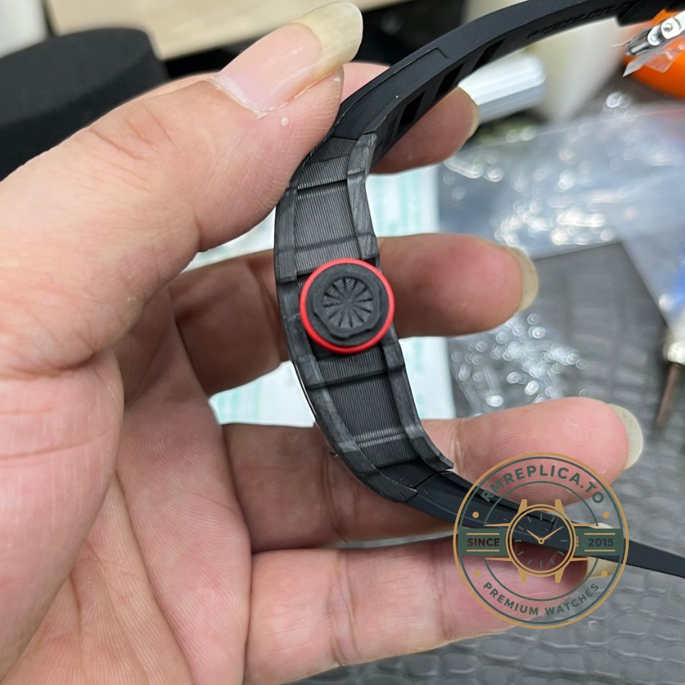 Richard Mille RM35-01 Rafa carbon fiber case black dial red crown black strap skeleton movement handheld front view – fake richard mille
