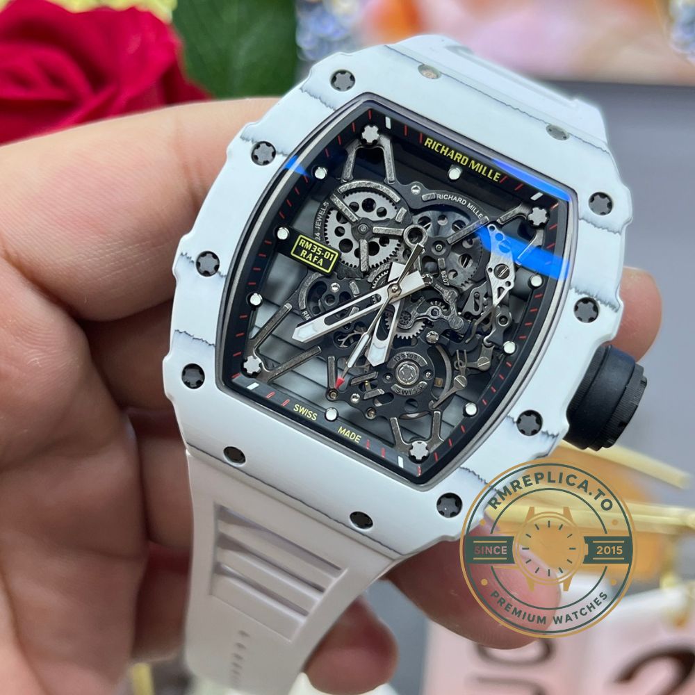 Fake Richard Mille RM35-01 white carbon case black skeleton dial white rubber strap handheld front view – fake richard mille
