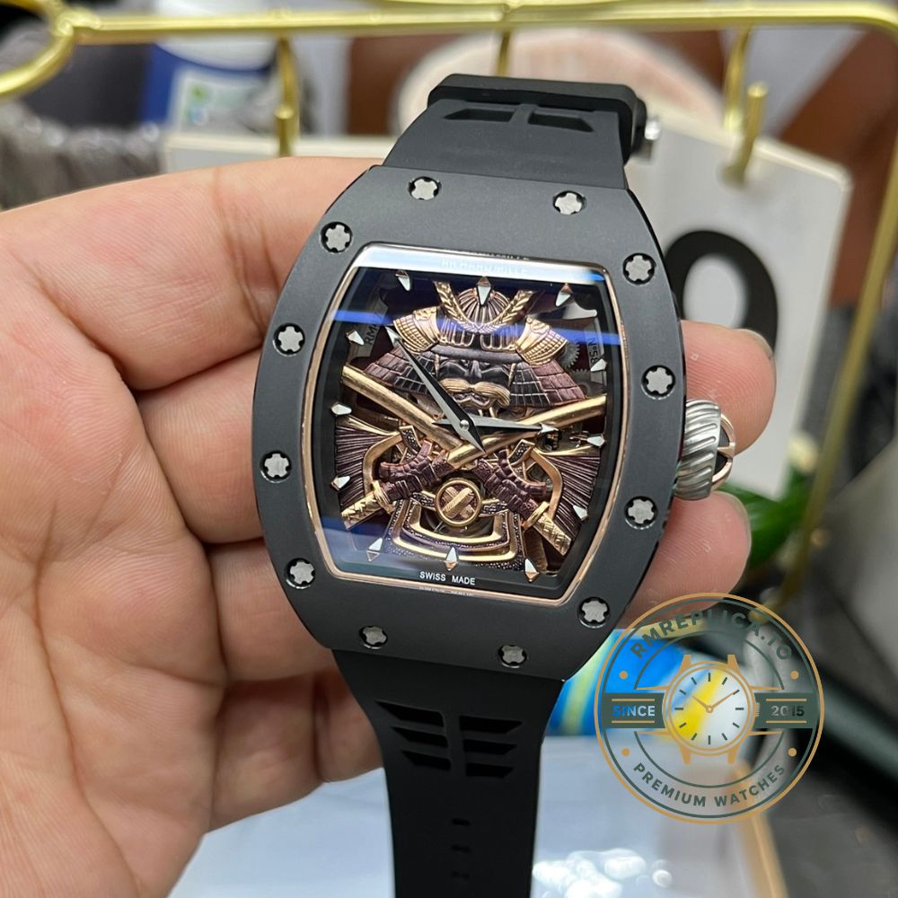 Replica Richard Mille watch RM47 samurai armor tourbillon handheld side detail view with rose gold mid case and black rubber strap – replica richard mille watch