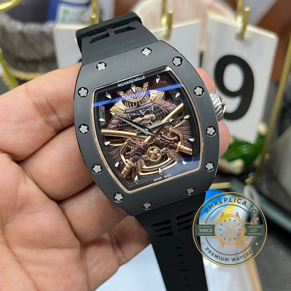Richard Mille clone RM47 samurai armor tourbillon watch handheld front view, black case and black rubber strap – richard mille clone