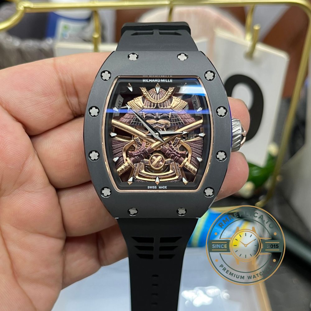 Best Richard Mille replica RM47 samurai tourbillon watch handheld front view, black case and black rubber strap – best richard mille replica
