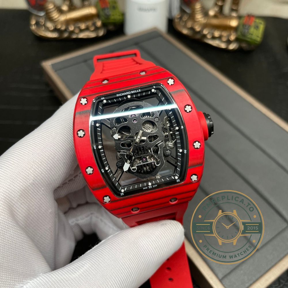 Replica Richard Mille RM 52-01 skeleton skull dial men's watch with red carbon case and red rubber strap front view – richard mille replica