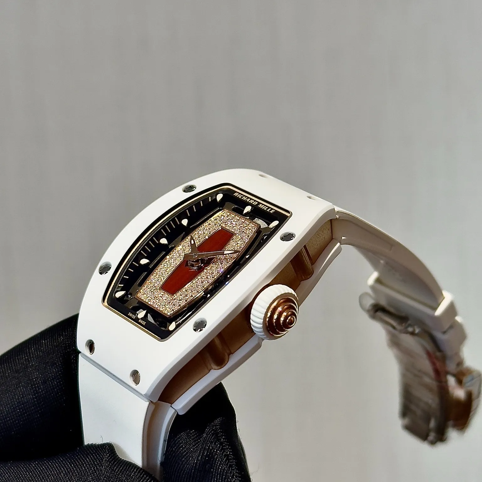Close up of the micro pave diamond dial and red lips motif on this replica richard mille watch.