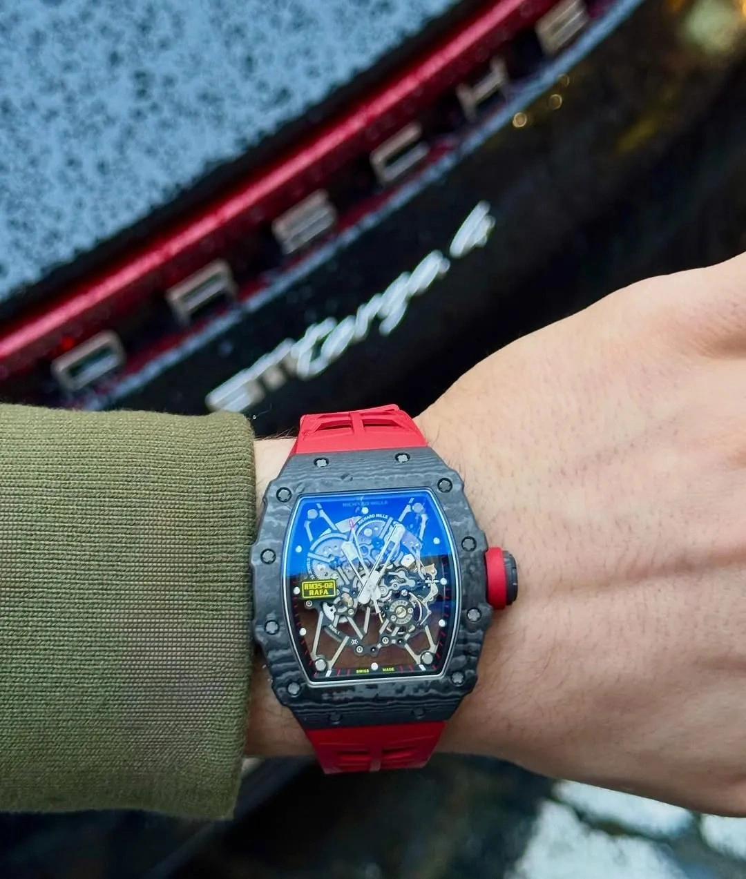 Customer wearing the Richard Mille RM 35-02 Rafael Nadal watch with a red strap during everyday use.