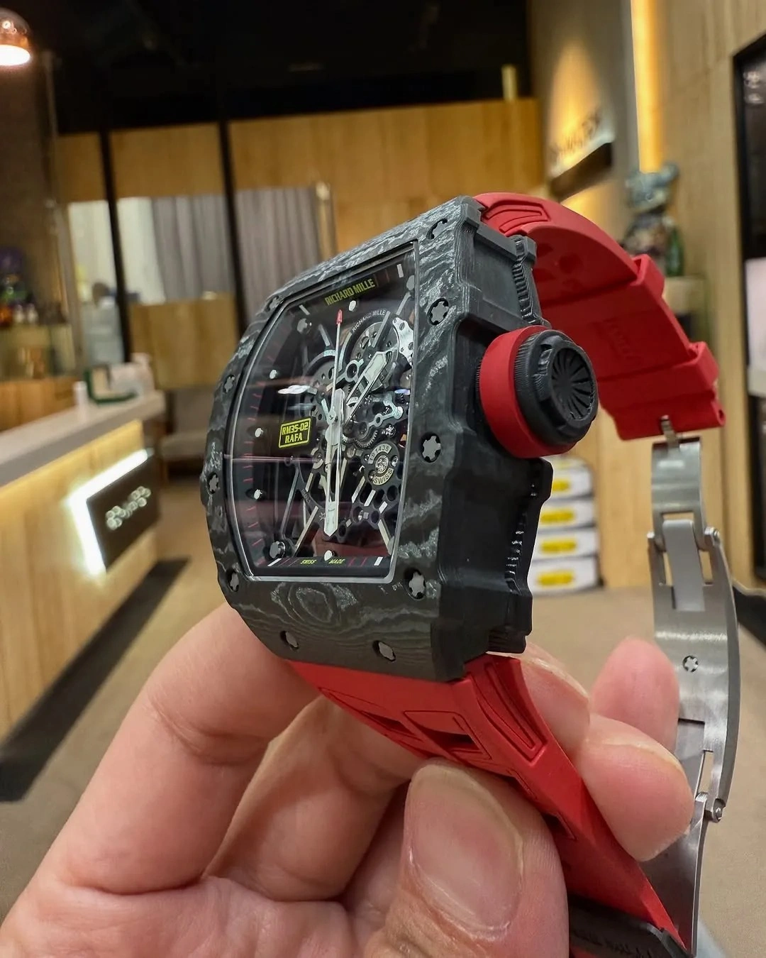 Customer wearing the Richard Mille RM 35-02 ZF V7 watch with a red strap during everyday use.