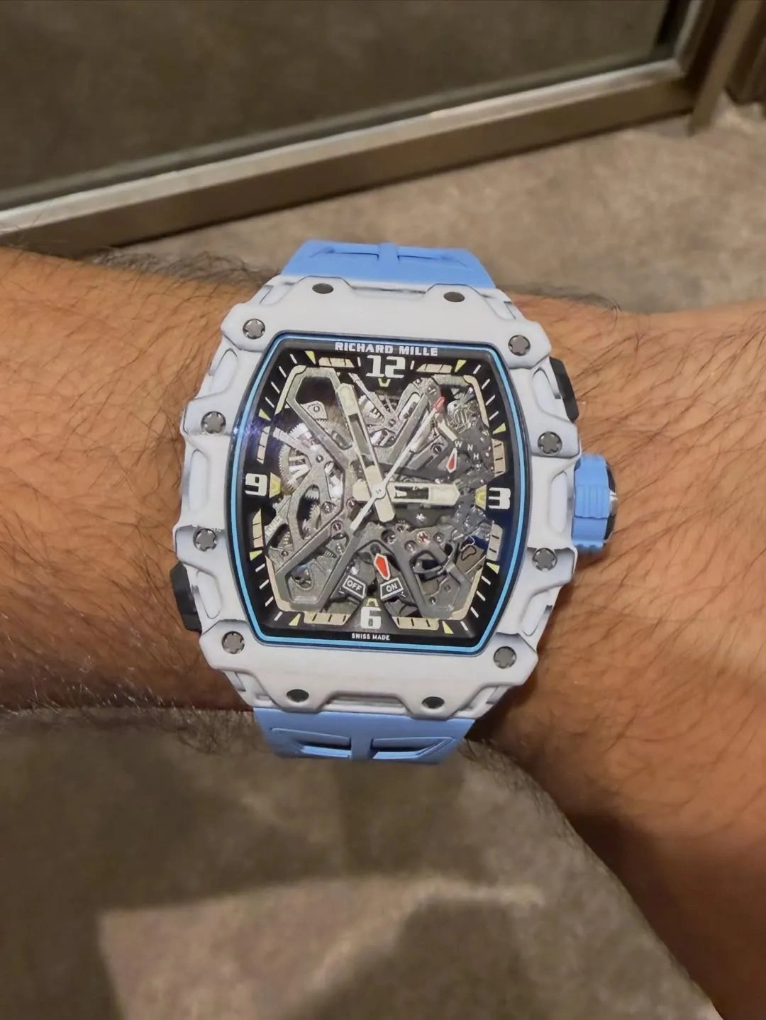 Customer wearing the Richard Mille RM 35-03 watch with a light blue strap during everyday use.