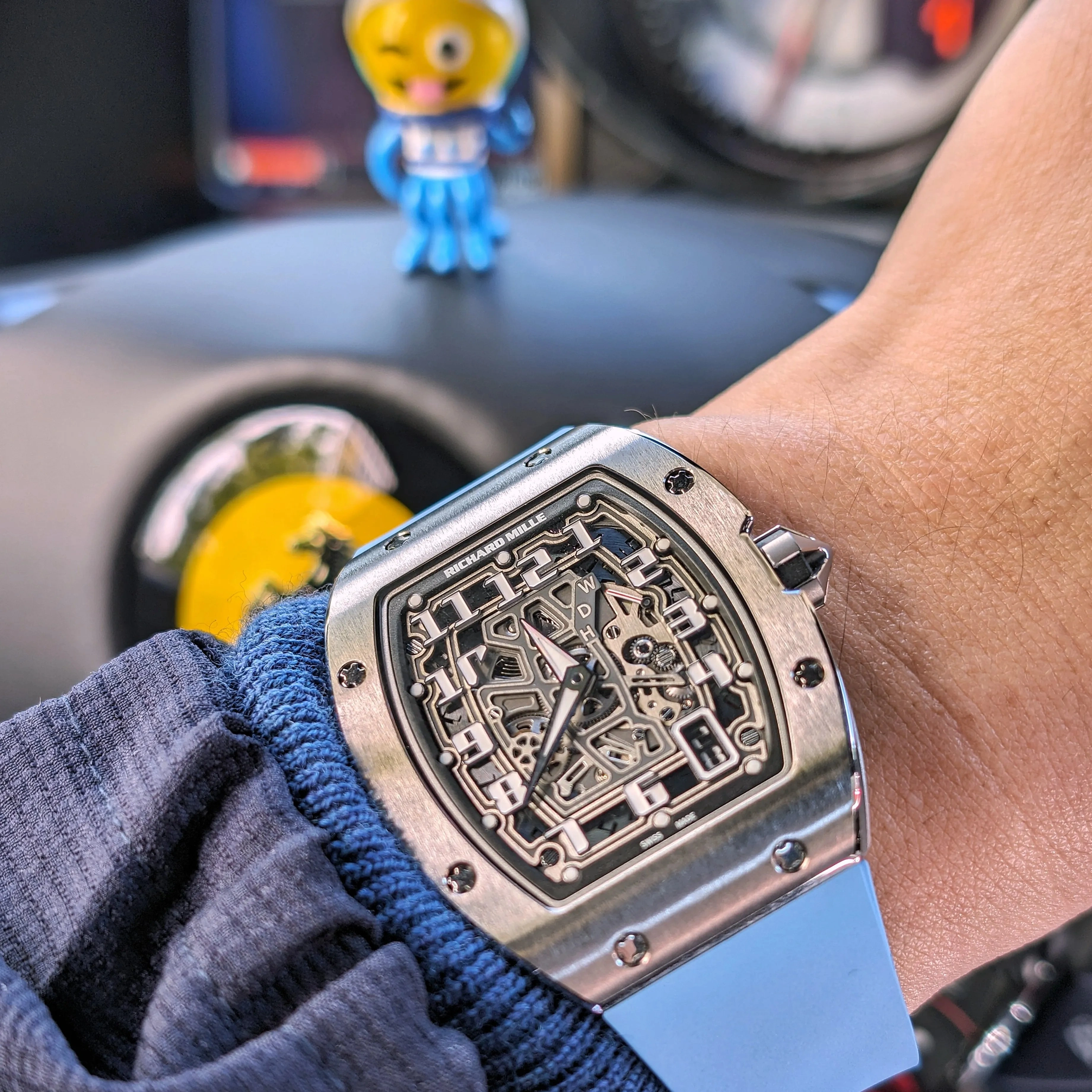 Customer wearing the Richard Mille RM 67-01 watch with a light blue strap during everyday use.