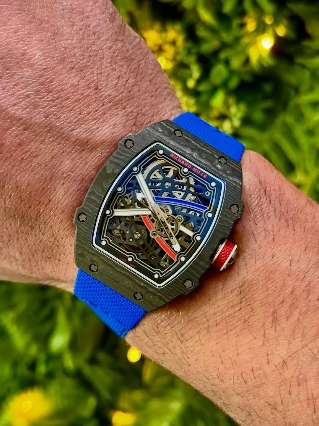 Customer wearing the Richard Mille RM 67 watch with a blue strap during everyday use.
